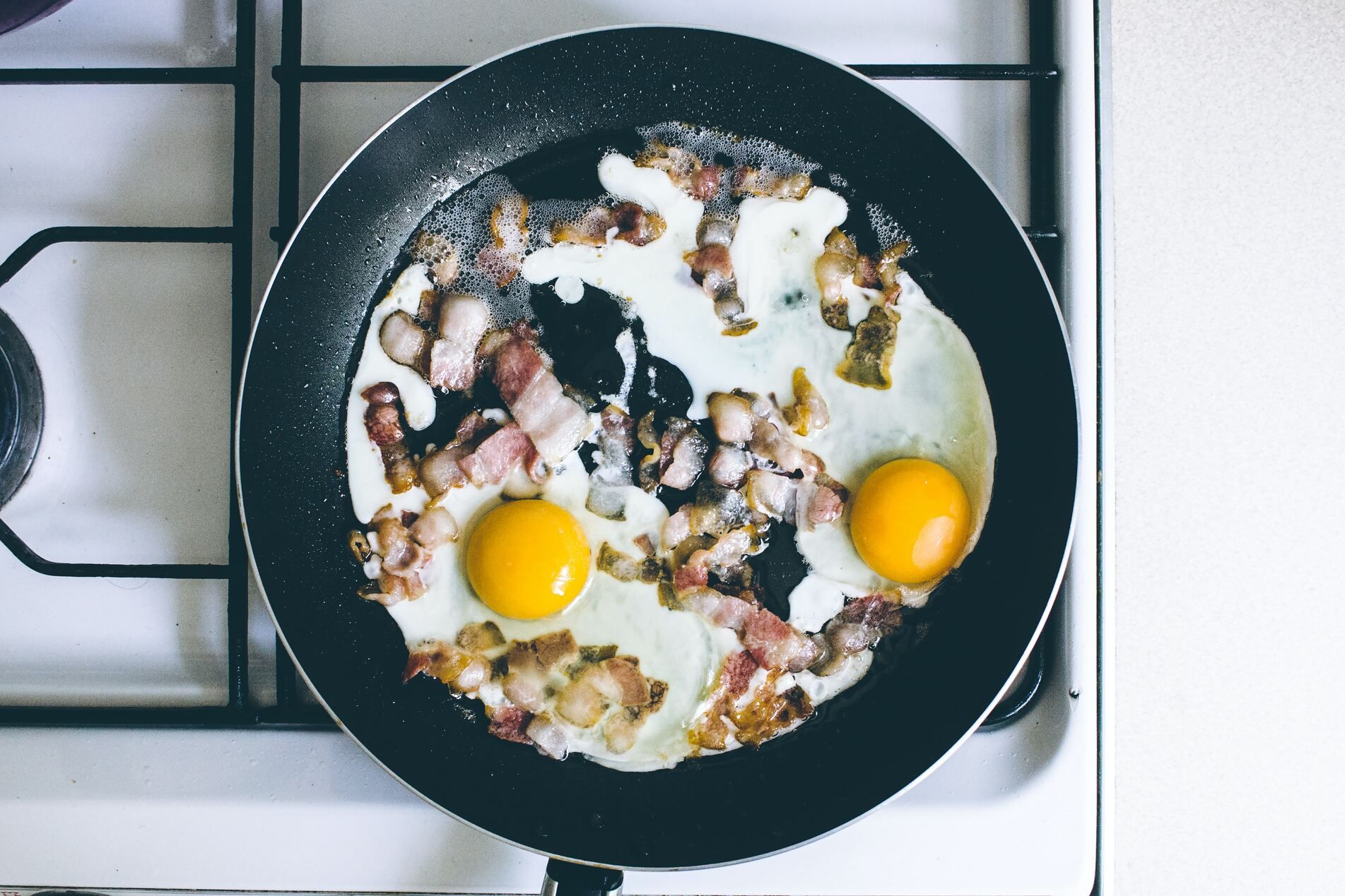 Heat butter in skillet. Pour in eggs. As eggs begin to set move spatula across bottom and side of skillet.